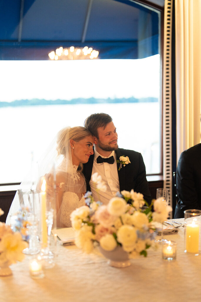 bride and groom in wisconsin watching speeches